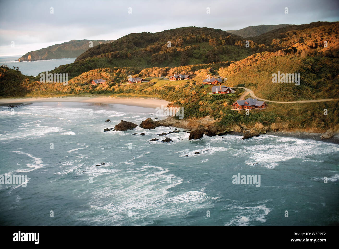 Small village of houses on a picturesque coastline Stock Photo - Alamy