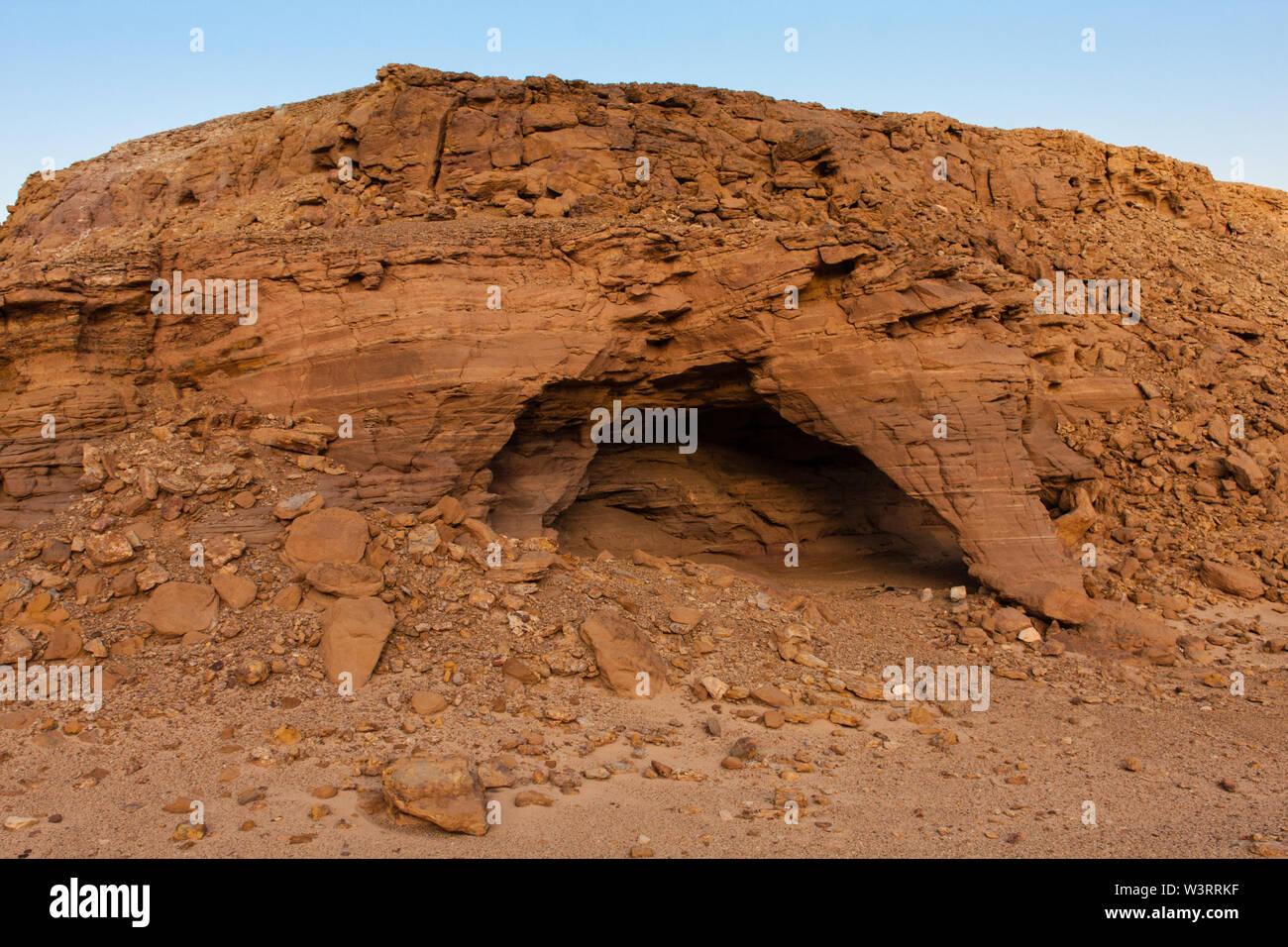 A natural shelter formed by erosion. An example of the ornate natural