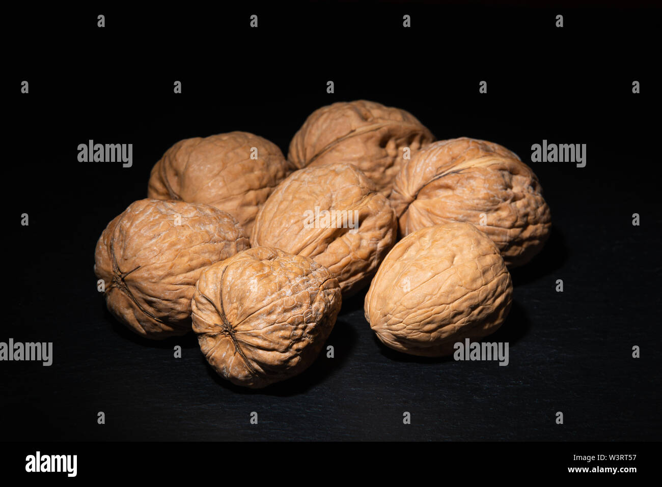 Delicious walnuts on black background Stock Photo