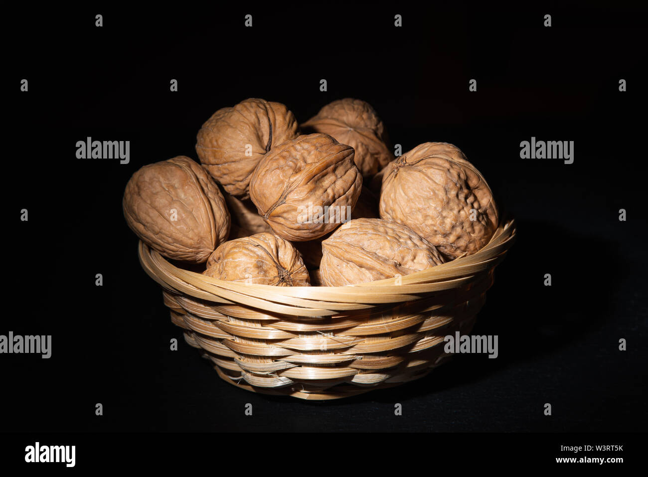 Delicious walnuts on black background Stock Photo