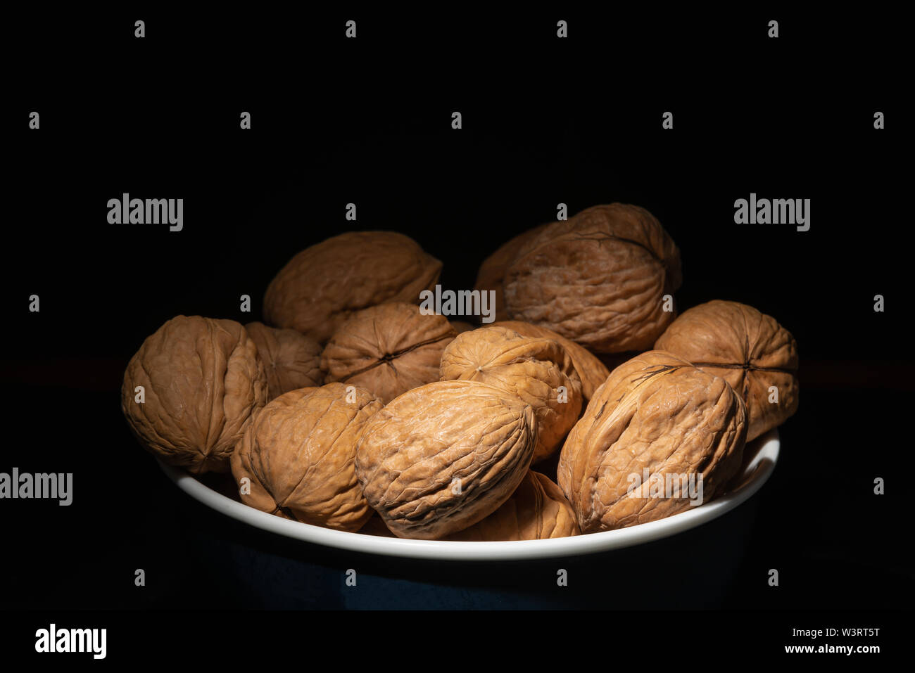 Delicious walnuts on black background Stock Photo