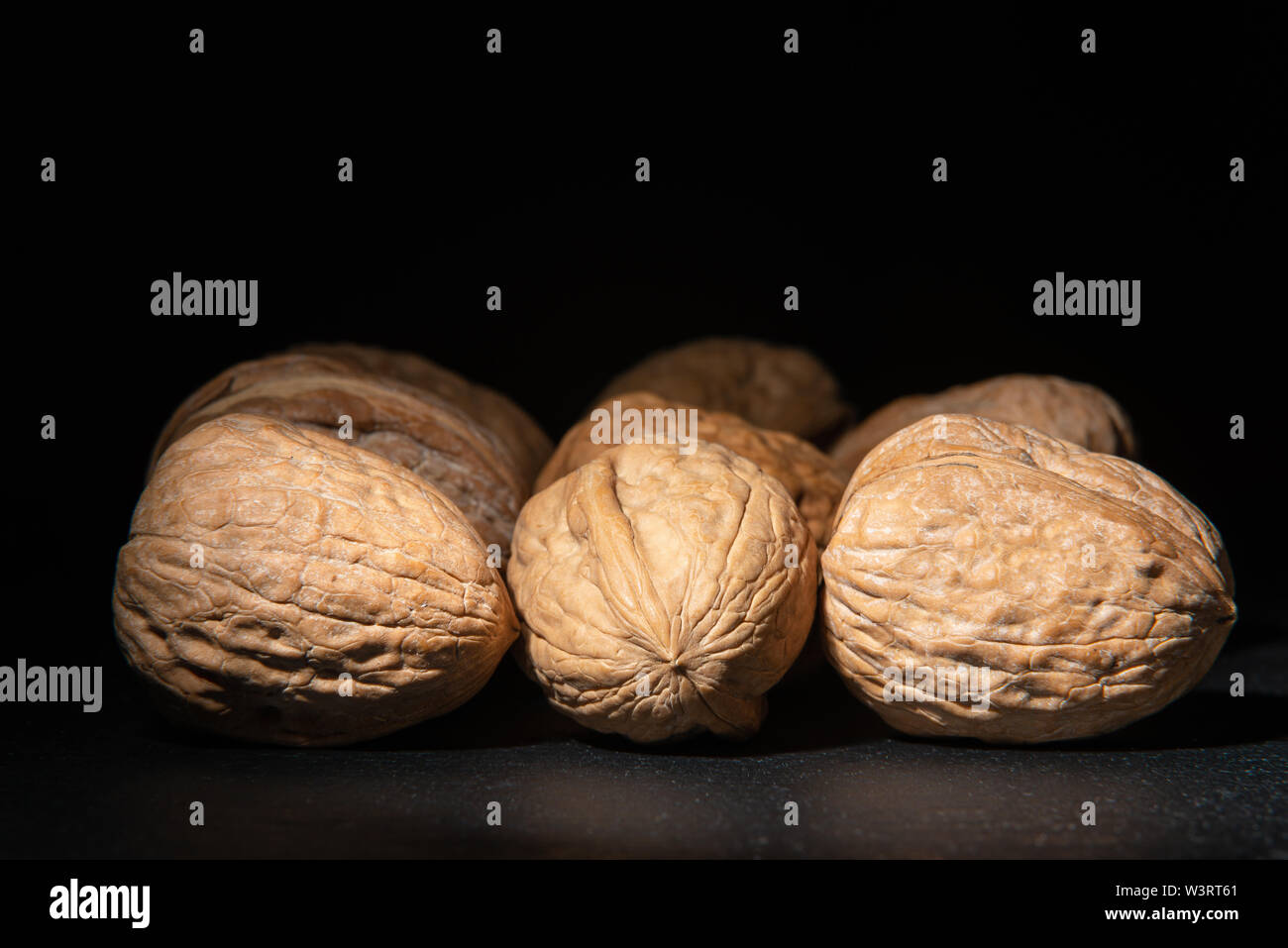 Delicious walnuts on black background Stock Photo
