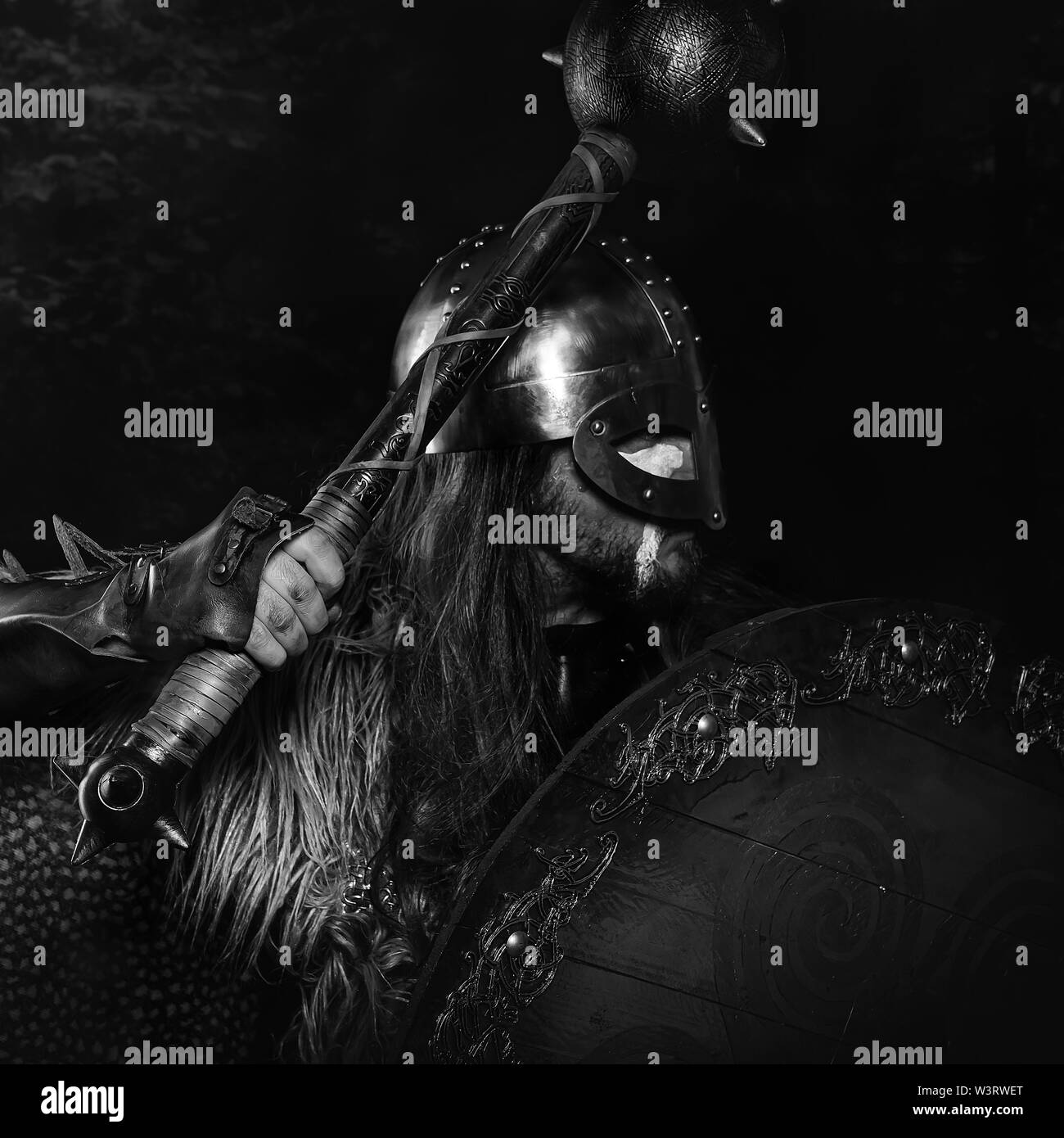 Viking scandinavian warrior with sword and wild skins. leather and bib