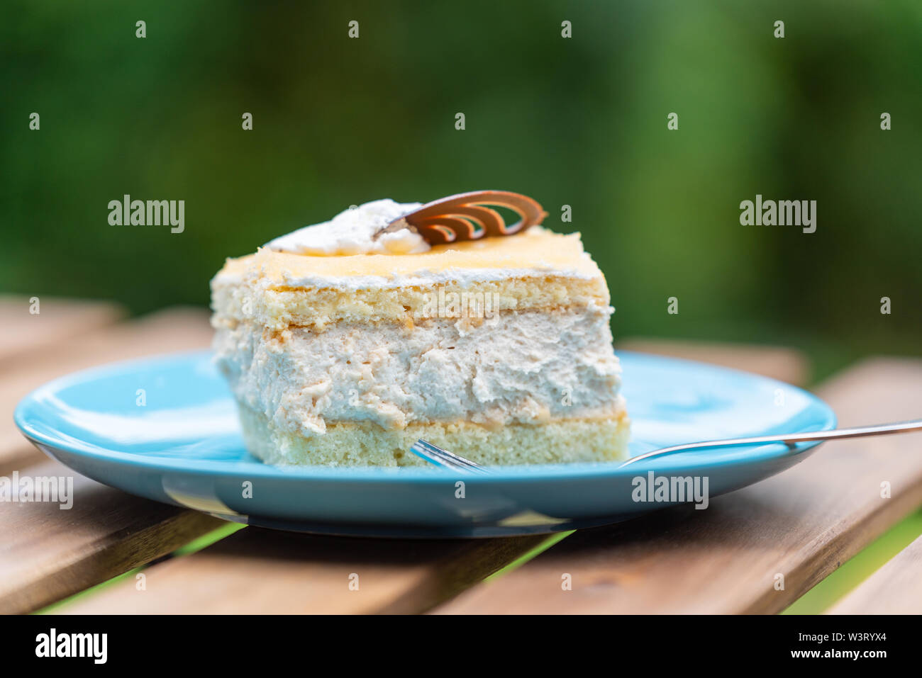 Cream nut cuts on a plate with a fork Stock Photo