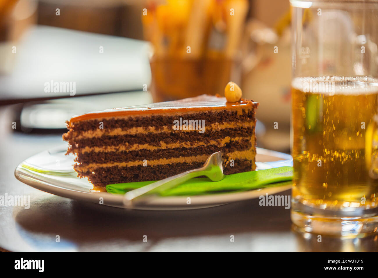 On a warm summer's day a piece of delicious cake and a cool drink Stock Photo