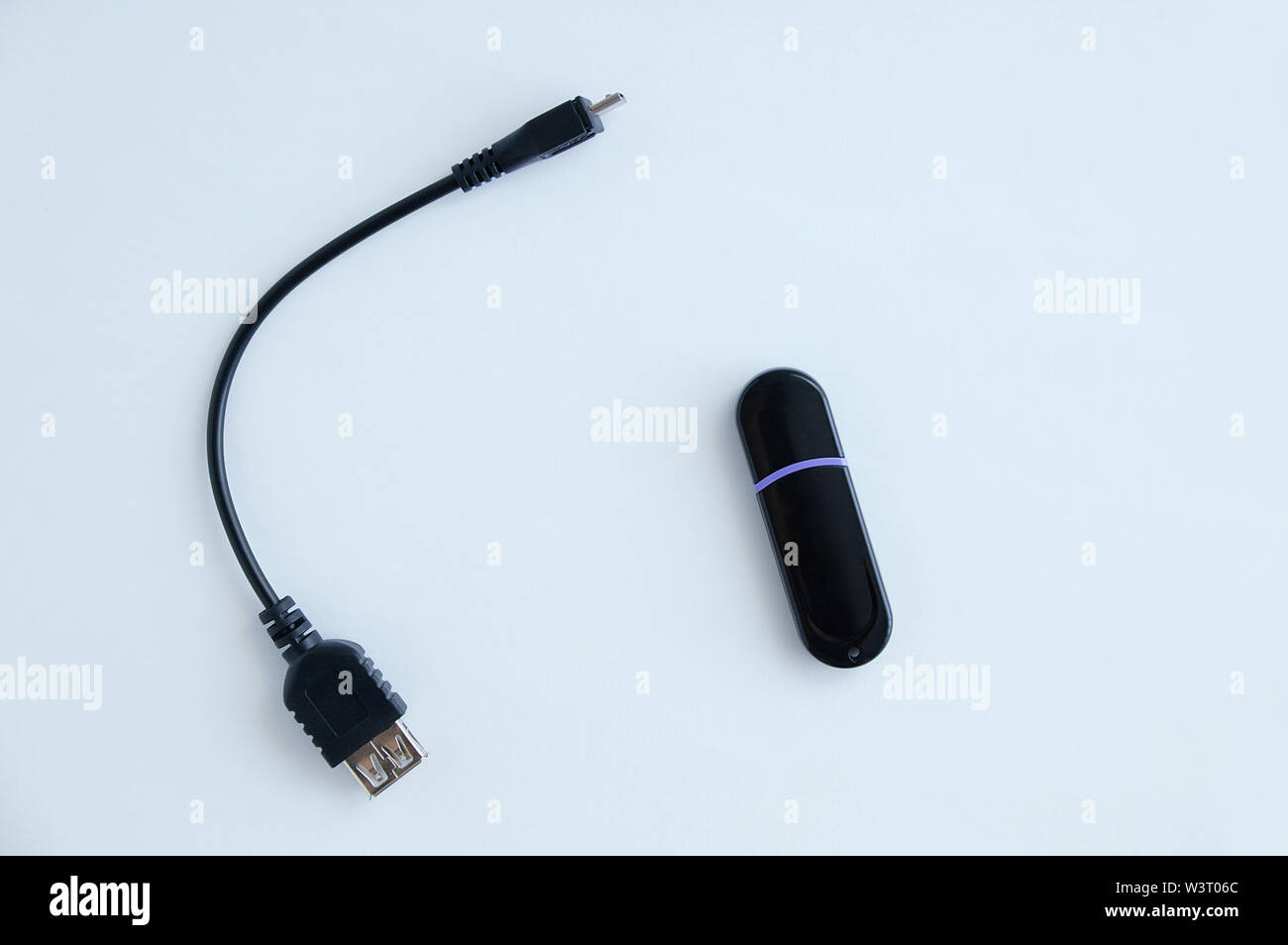 Cable otg for smartphone and flash drive. White background. Stock Photo