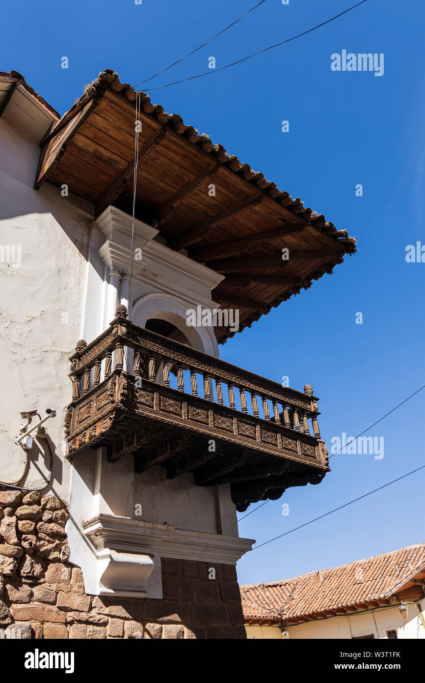 Wooden balcony on corner of Calle Hatunrumiyoc in Cusco, Peru, South America Stock Photo