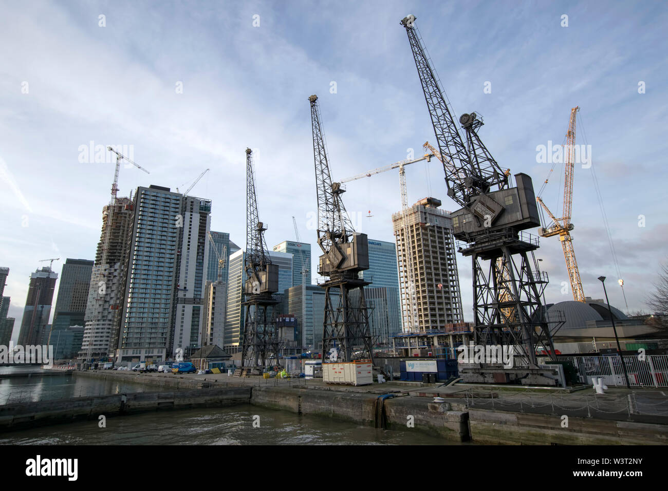 some giant cranes near construction site in canary Wharf London, UK Stock Photo