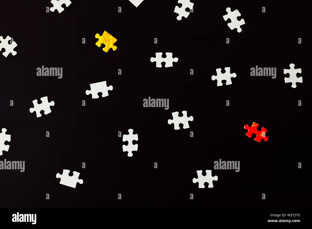 Black background with puzzle pieces Stock Photo - Alamy