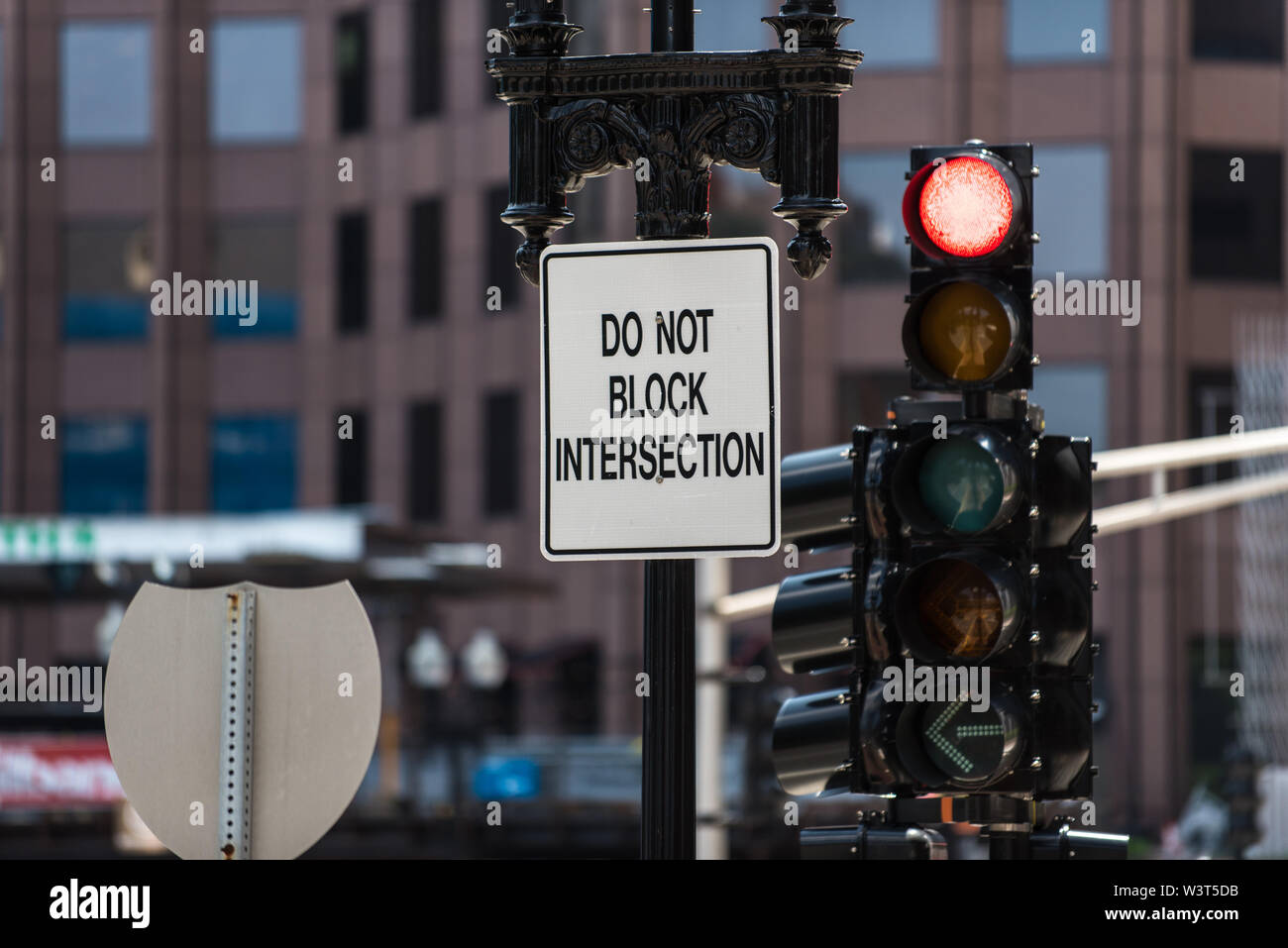 Signs and traffic lights help control traffic flow on downtown
