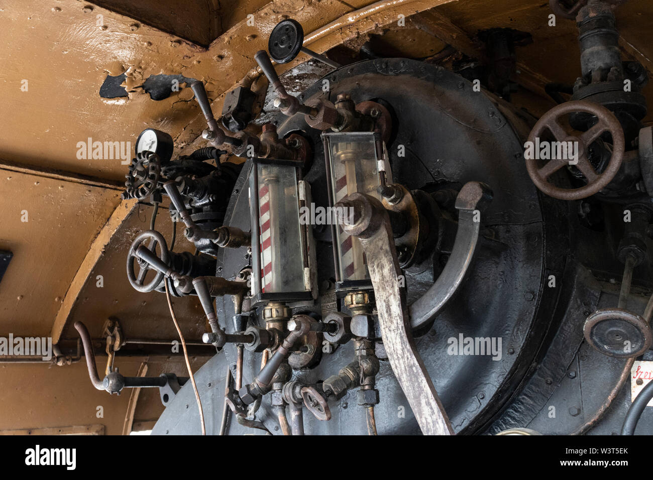 BUDAPEST, HUNGARY - April 05, 2019: Firebox and valves of a historic steam locomotive at the Hungarian Railway Museum. Stock Photo