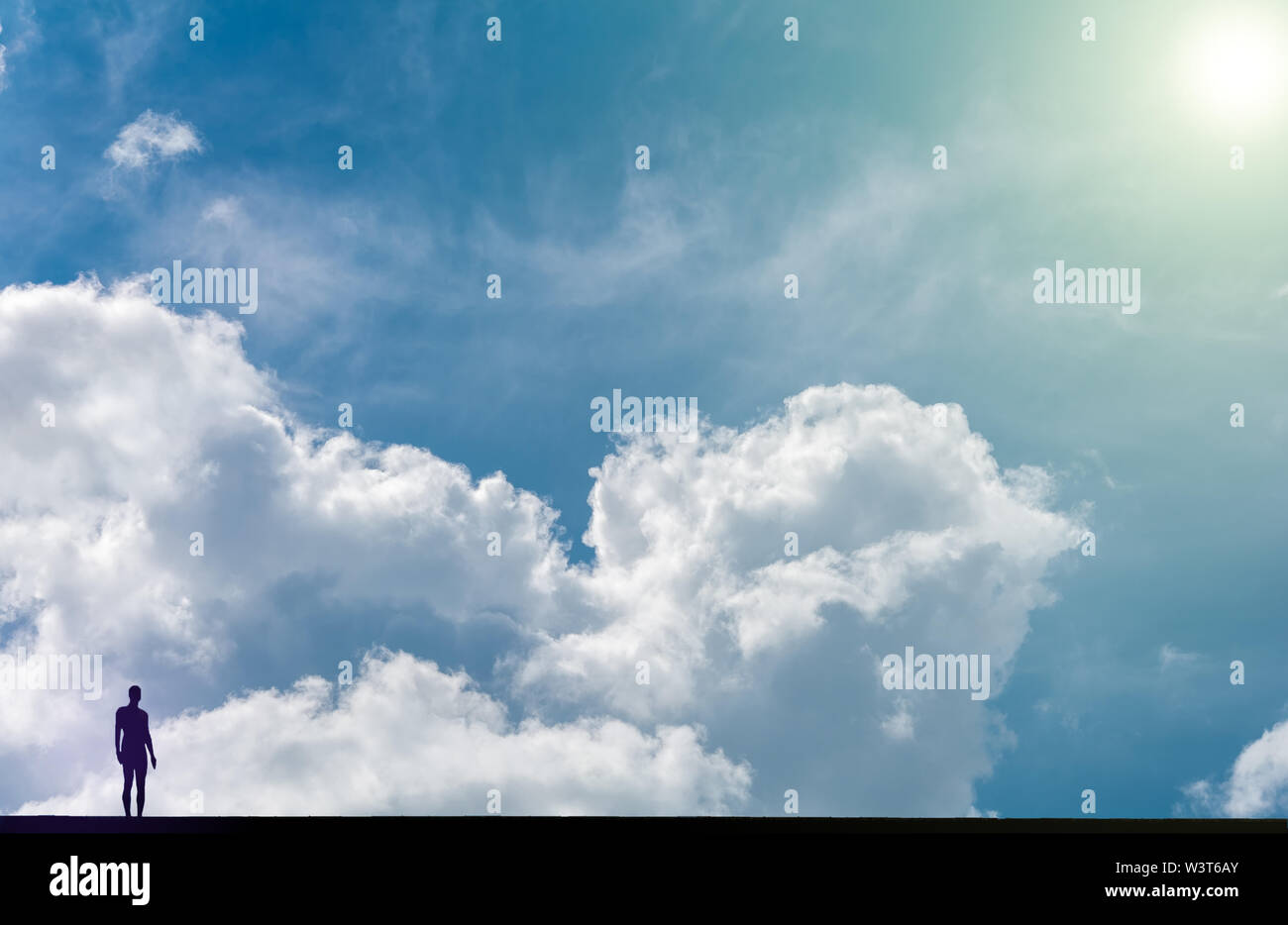 The figure of a man against a relief sky Stock Photo