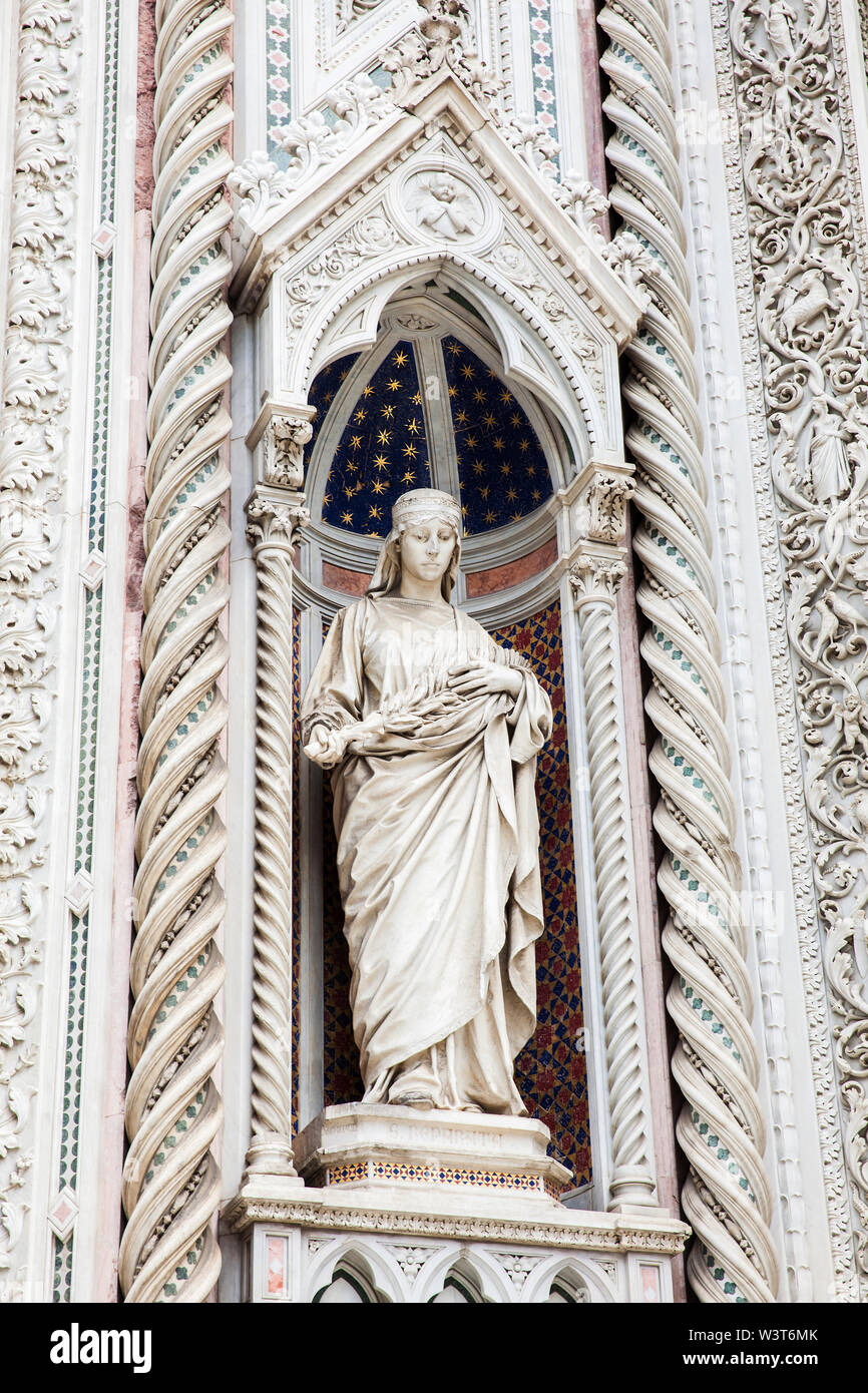 Statue on the facade of the beautiful Florence Cathedral formally called Cattedrale di Santa Maria del Fiore consecrated in 1436 Stock Photo