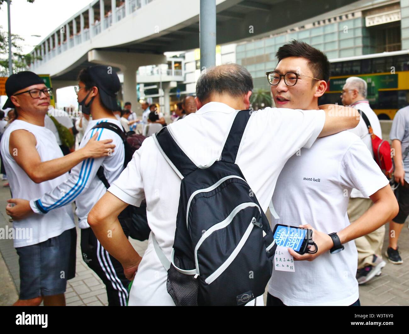 Hong Kong, China. July 17th, 2019. A few thousand Hong Kong senior citizens march in a show of support for the youths protest against a controversial extradition bill. Here the different generations show mutural respect to each other. Credit: Gonzales Photo/Alamy Live News Stock Photo