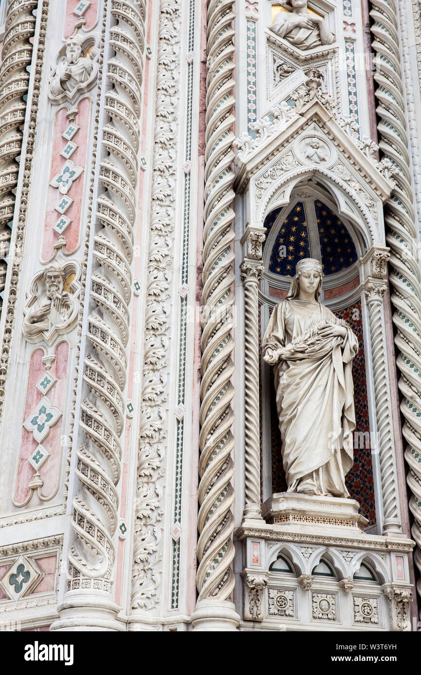 Statue on the facade of the beautiful Florence Cathedral formally called Cattedrale di Santa Maria del Fiore consecrated in 1436 Stock Photo