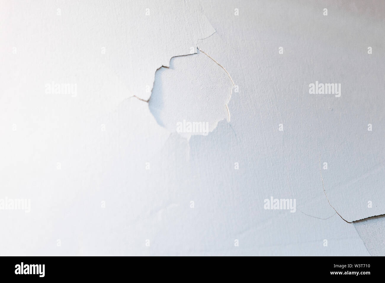 Abstract background. White old wall with whitewashed flown. Stock Photo