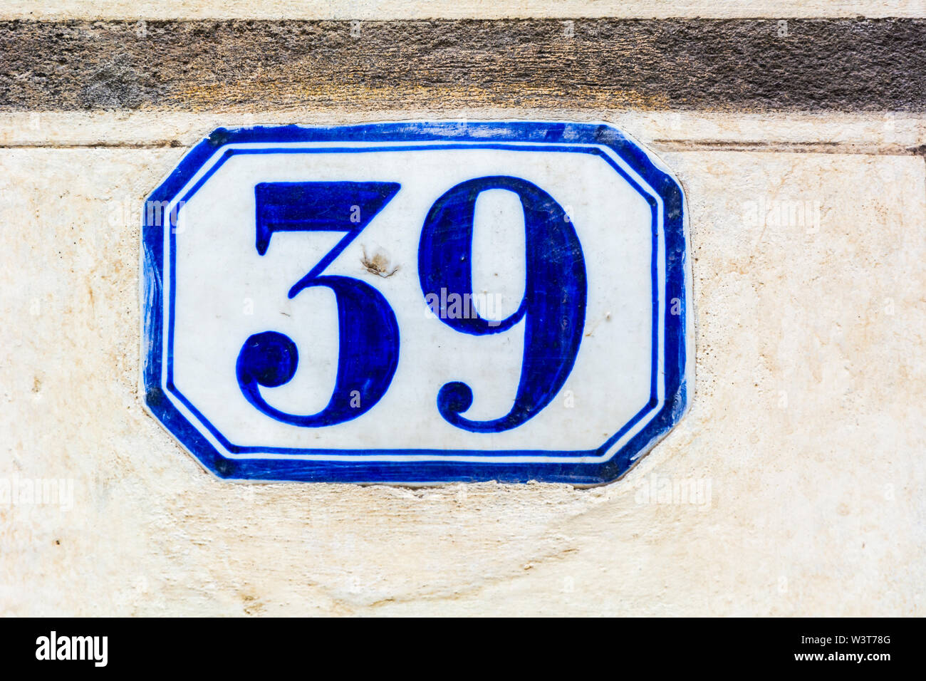 house number thirty nine ( 39 ) on a roughcast wall Stock Photo