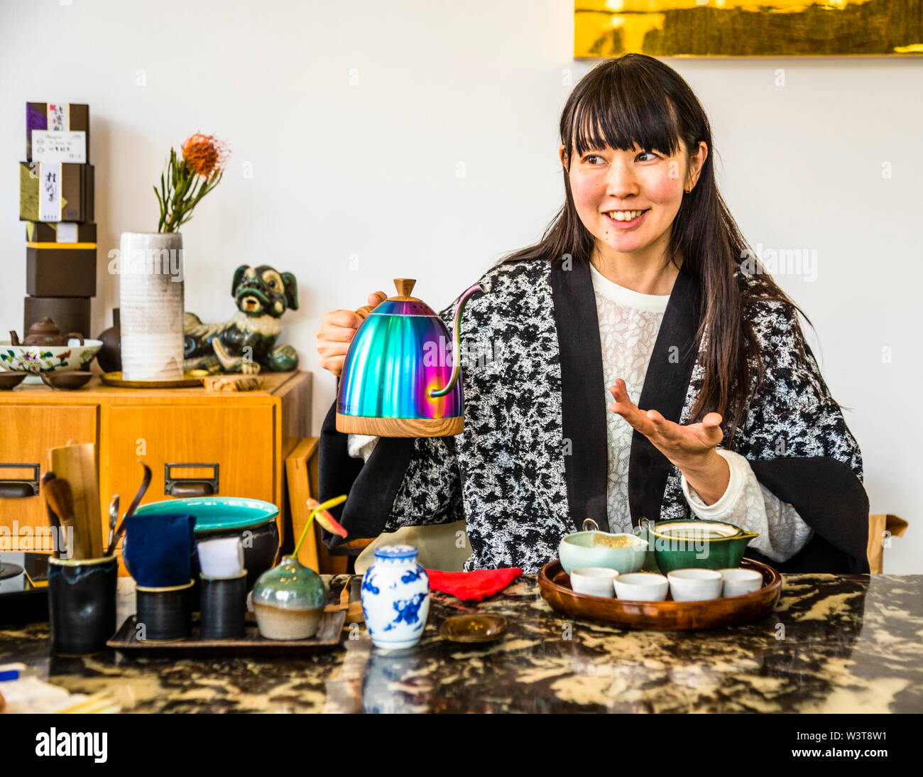 Japanese Green Tea Ceremony in Düsseldorf, Germany. The way to Motoko Dobashi is not so far. In Düsseldorf at AN/MO, you can watch her perform a tea ceremony. She regularly visits tea producers in Japan and buys the best qualities directly from the producer Stock Photo