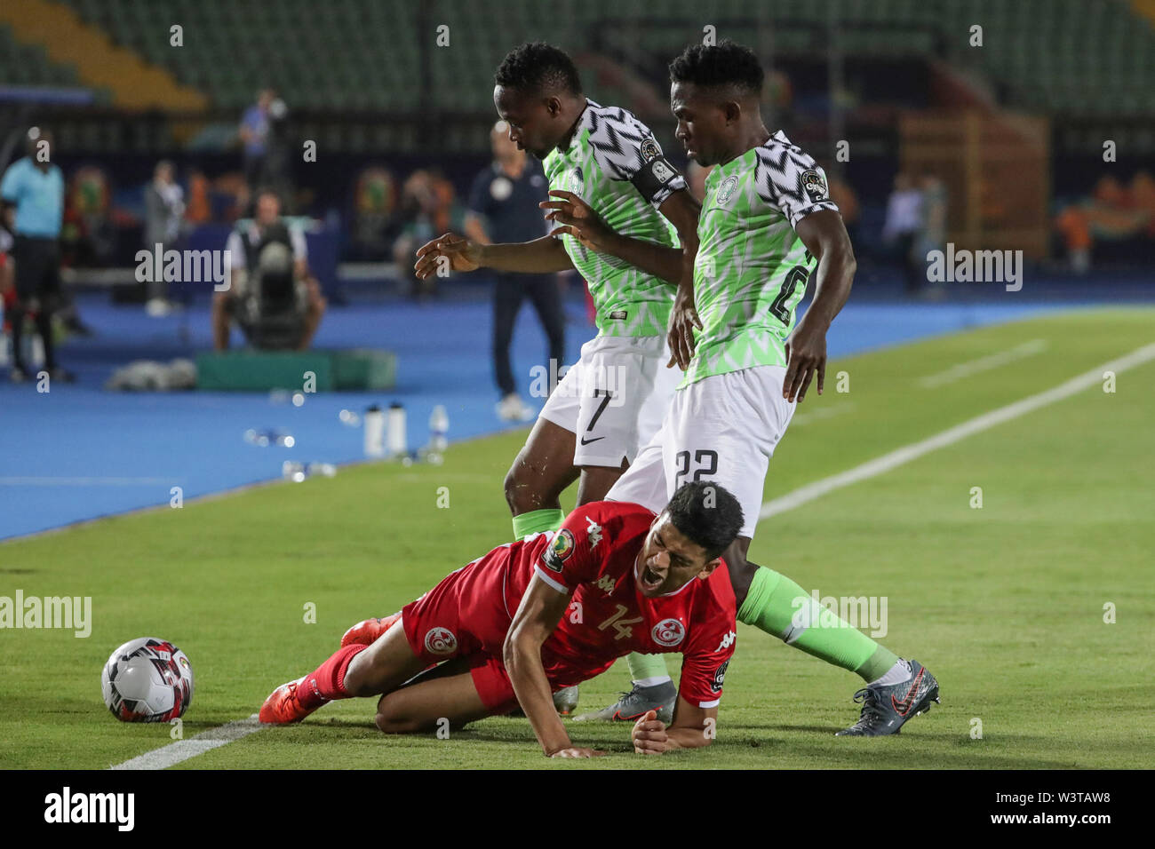 Cairo, Egypt. 17th July, 2019. Nigeria's Ahmed Musa and Nigeria's Kenneth Omeruo battle for the ball with Tunisia's Mohamed Drager during the 2019 Africa Cup of Nations third place final soccer match between Tunisia and Nigeria at the Al-Salam Stadium. Credit: Gehad Hamdy/dpa/Alamy Live News Stock Photo