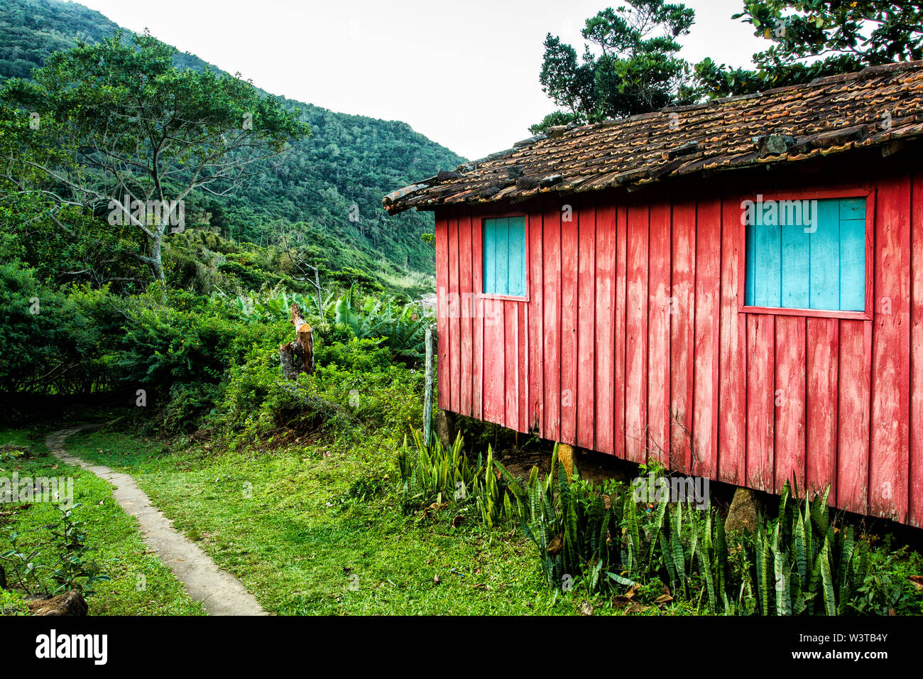 Colorful wooden house at Saquinho Beach community. Florianopolis, Santa