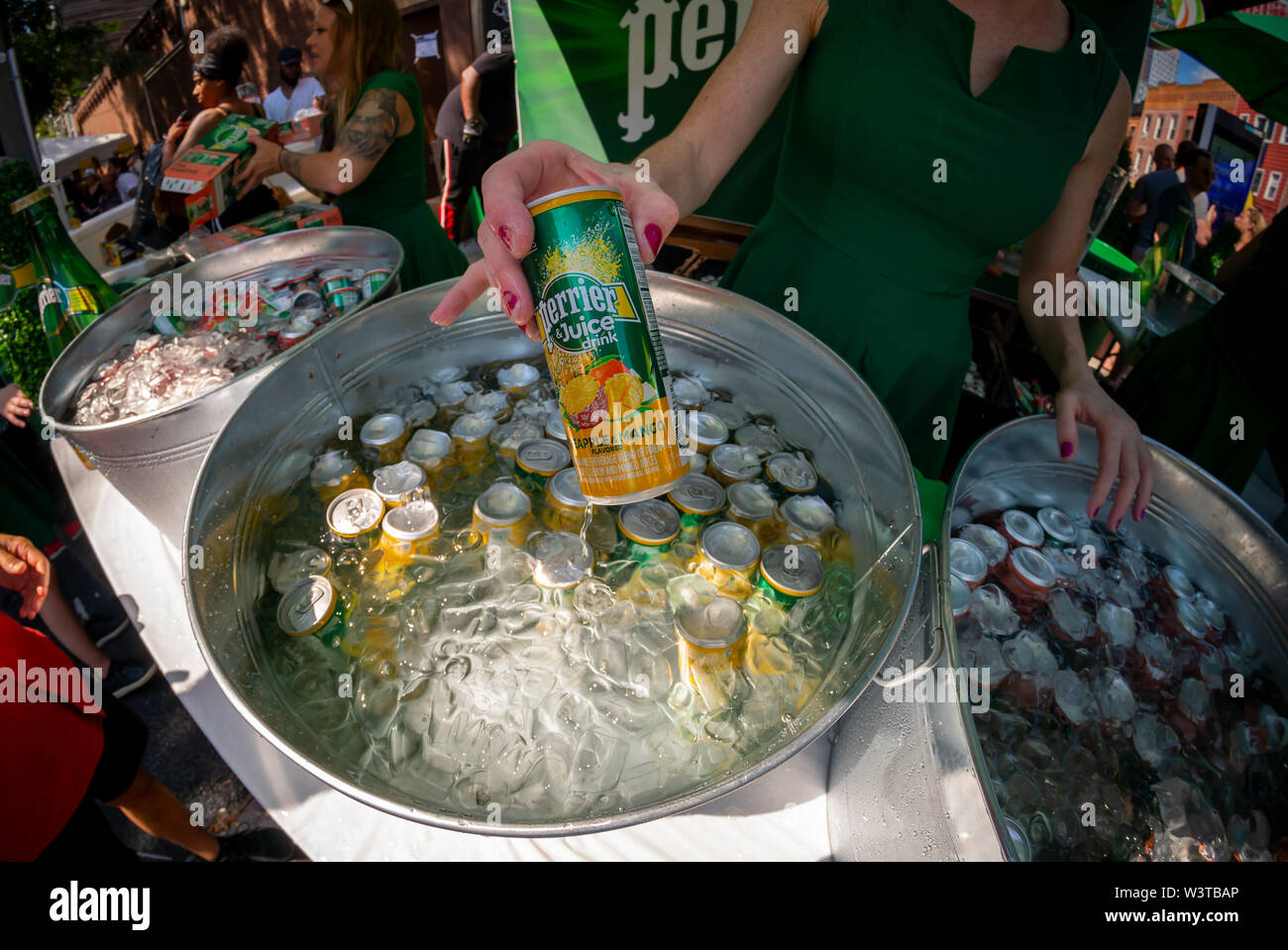 Cans of Perrier juice flavored carbonated water, seen at a street fair in New York on Sunday, July 14, 2019. The new product from Nestlé Waters, Perrier's parent company, addresses the increased popularity of flavored carbonated waters spear-headed by the millennial favorite La Croix. (© Richard B. Levine) Stock Photo