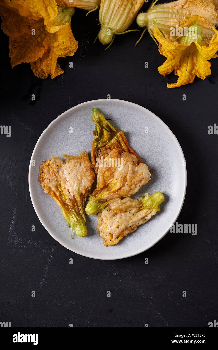 fried zucchini flowers deep fried on plate top view Stock Photo Alamy