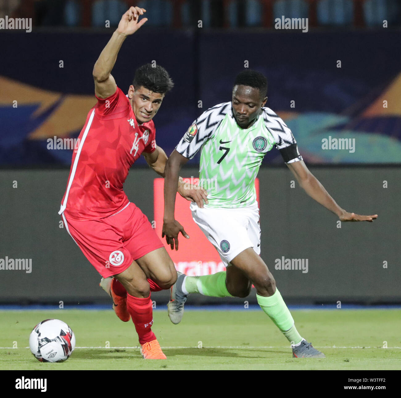 Cairo, Egypt. 17th July, 2019. Tunisia's Mohamed Drager vies for the ball with Nigeria's Ahmed Musa during the 2019 Africa Cup of Nations third place final soccer match between Tunisia and Nigeria at the Al-Salam Stadium. Credit: Gehad Hamdy/dpa/Alamy Live News Stock Photo
