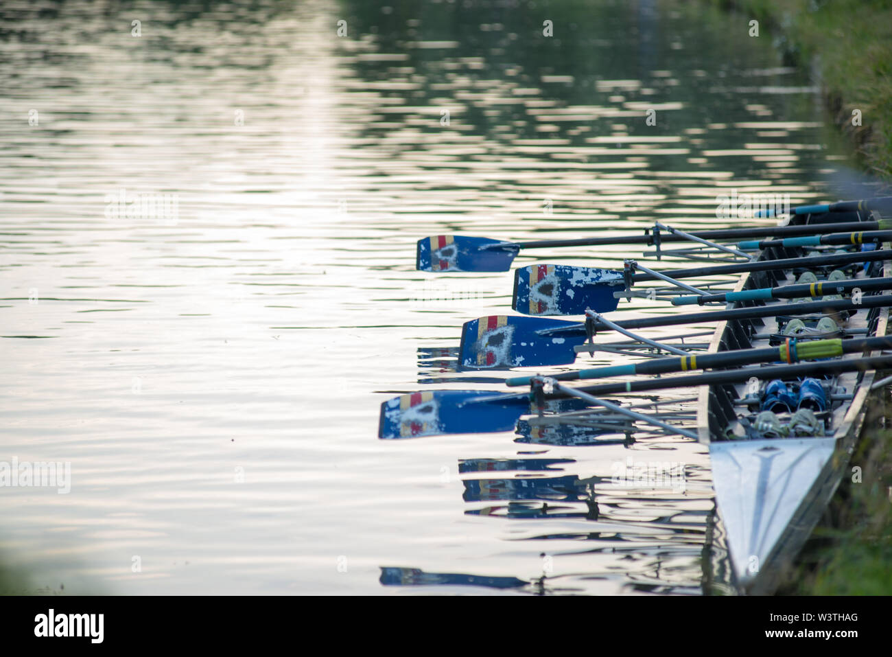 Cambridge UK, 20190717. 8 man rowing boat moored on river bank during