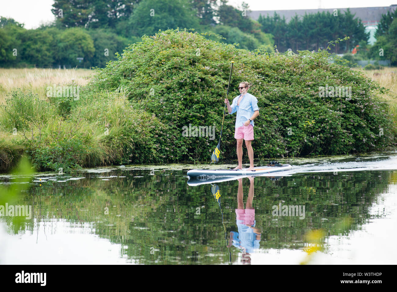 Cambridge UK, 20190717. 8 man standing on paddleboard on the river cam during the annual city