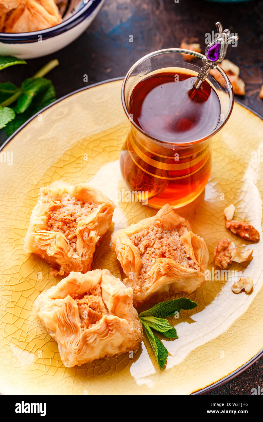 Middle Eastern or Arabic tea with mint in a traditional glass cup and