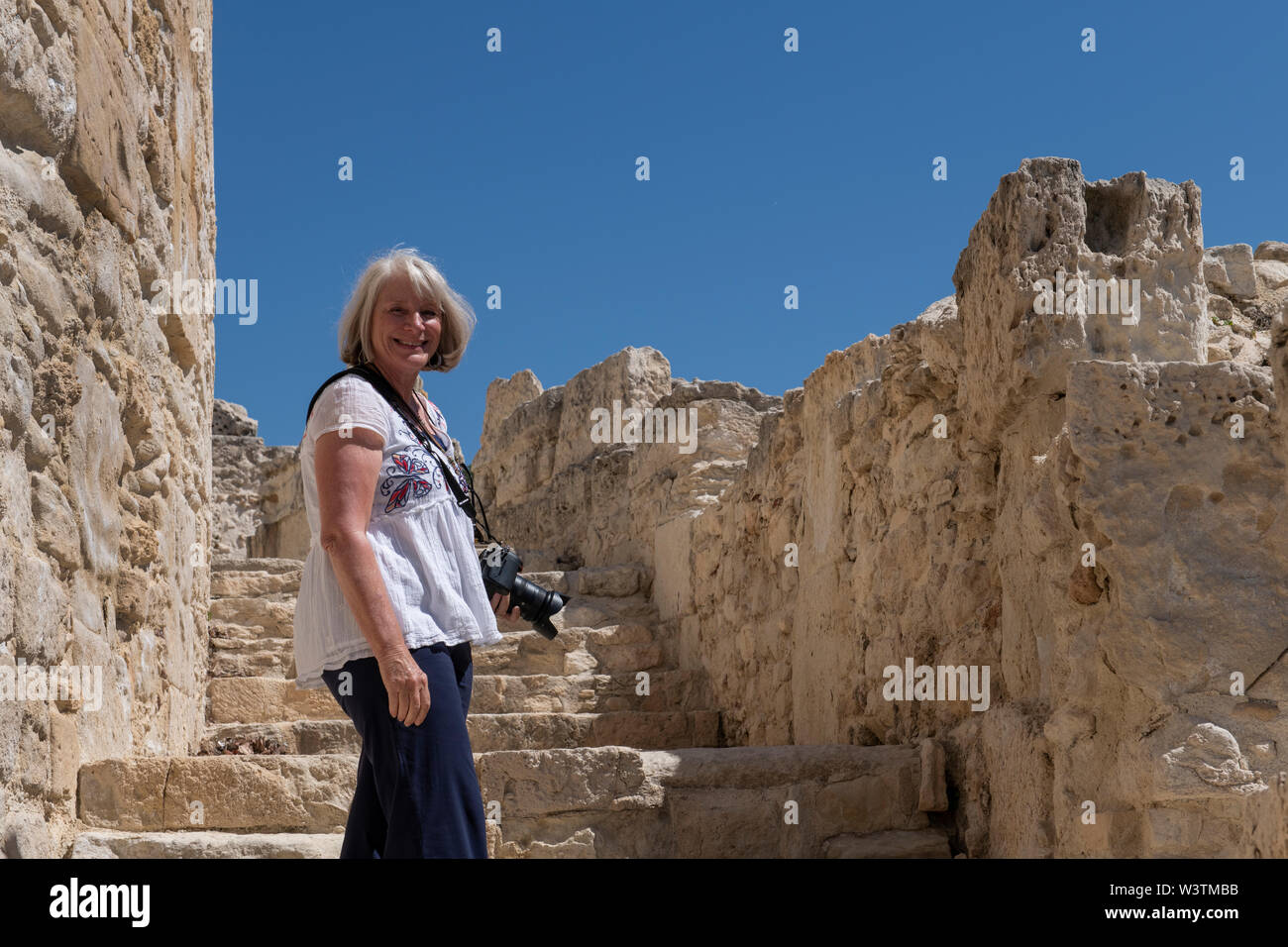Cyprus, ancient archaeological site of Kourion. Female tourist, model released. Stock Photo