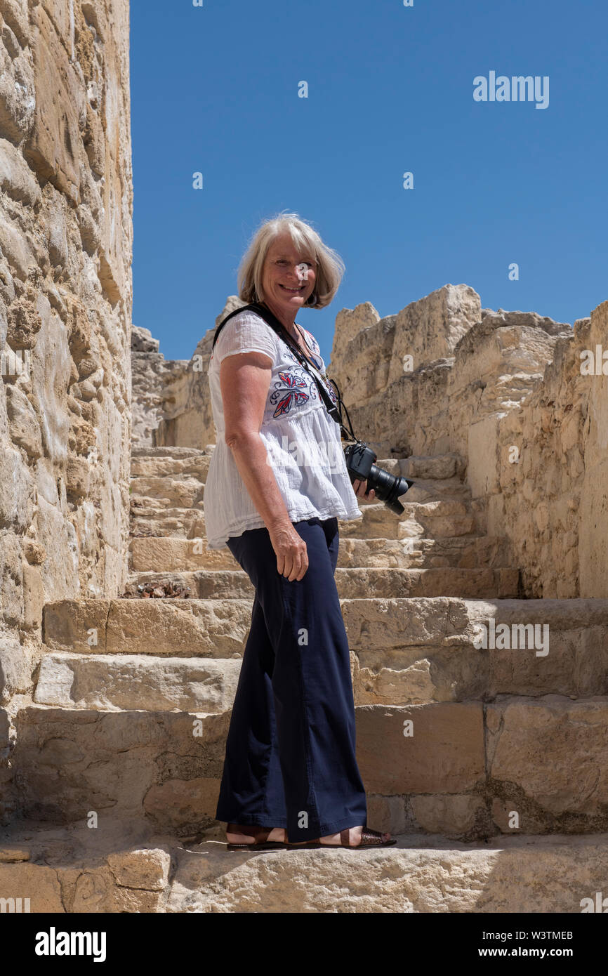 Cyprus, ancient archaeological site of Kourion. Female tourist, model released. Stock Photo