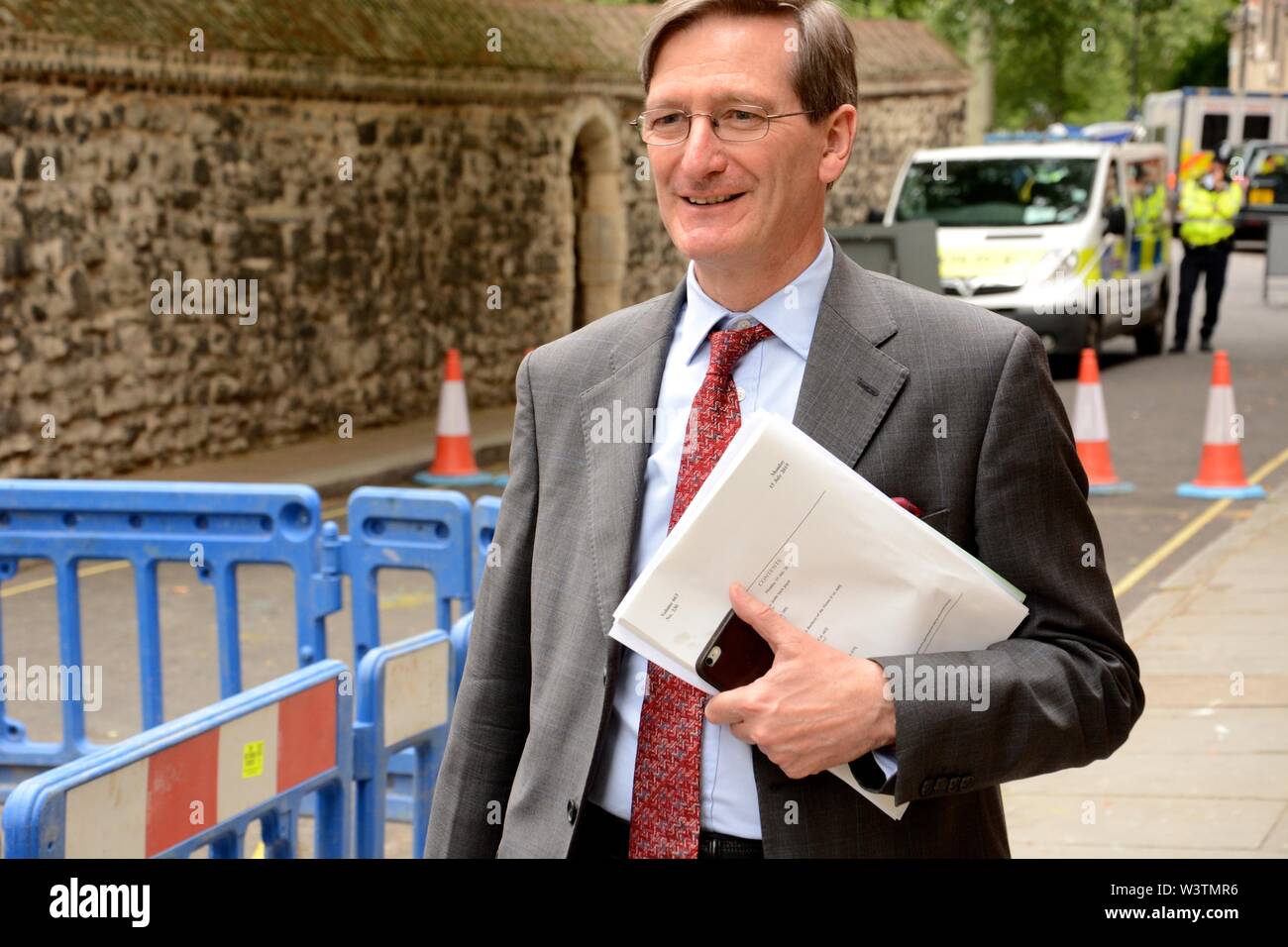 Dominic Grieve in good spirits as he walks past 16 Great College St where Boris Johnson has been holed up for 8 hrs, 17th July 2019. Stock Photo