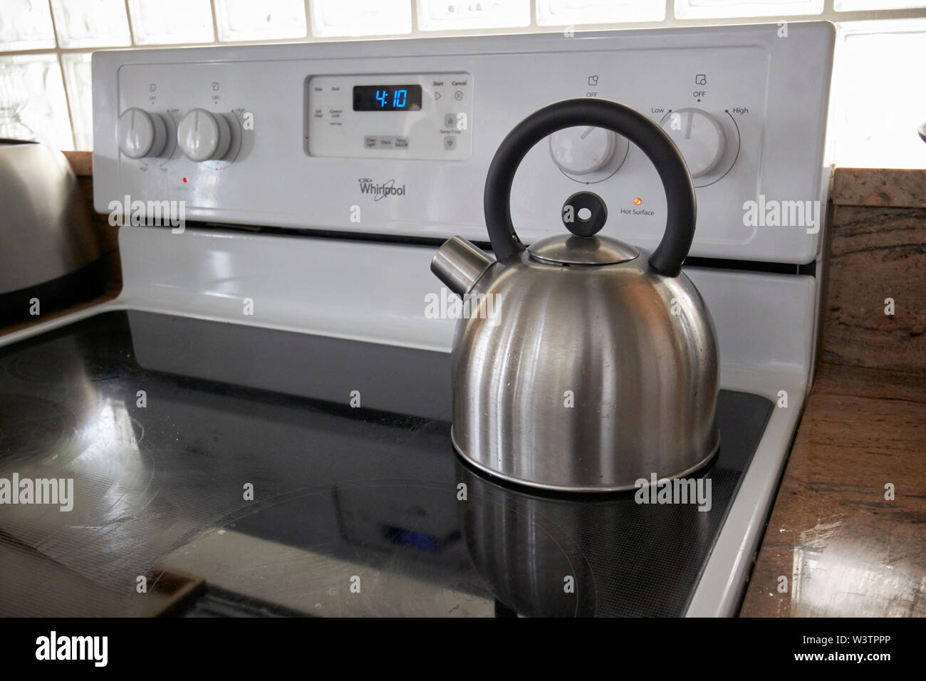 https://c8.alamy.com/comp/W3TPPP/metal-kettle-on-a-whirlpool-electric-stove-top-boiling-water-in-a-kitchen-in-the-usa-united-states-of-america-W3TPPP.jpg