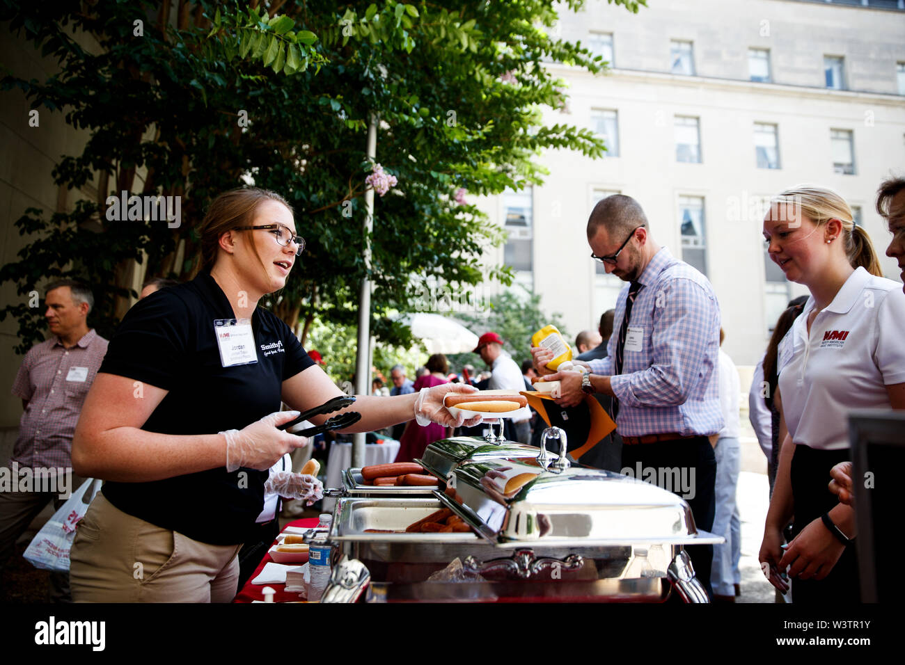 Washington, USA. 17th July, 2019. Hot dog vendors serve hot dogs to U.S. congressional members and staffers at the Rayburn House Office Building on Capitol Hill in Washington, DC, the United States, on July 17, 2019. The event was held here on Wednesday in celebration of the National Hot Dog Day. Credit: Ting Shen/Xinhua/Alamy Live News Stock Photo
