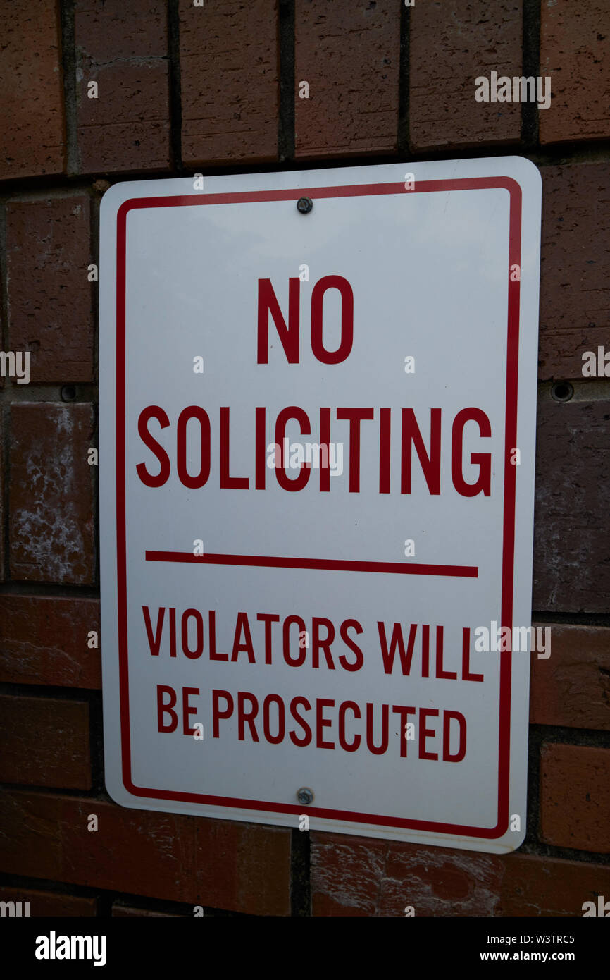 no soliciting violators will be prosecuted sign at the entrance to a gated community in florida USA United States of America Stock Photo