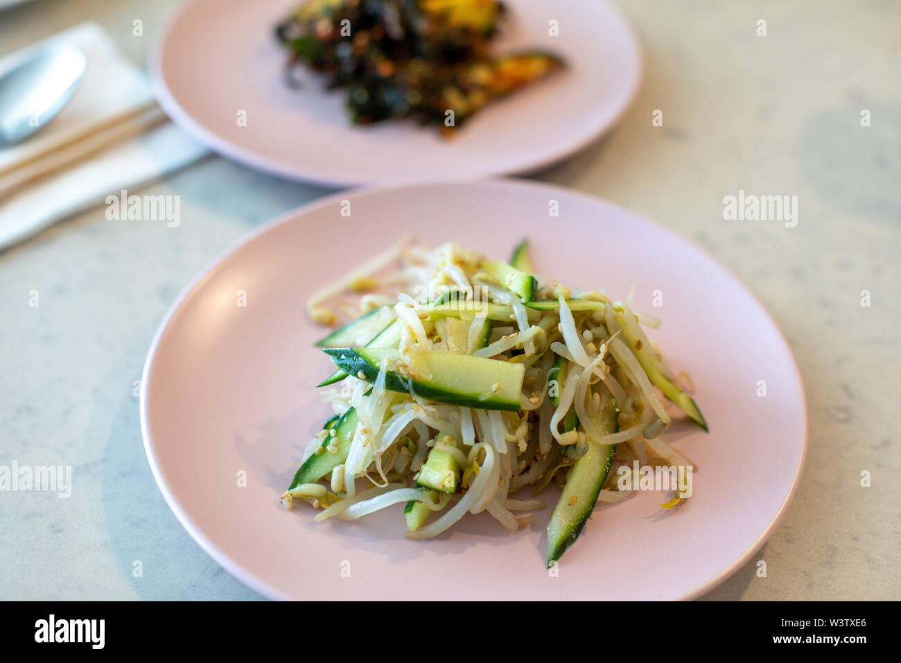 Seasoned mung bean sprouts and cucumber, Banchan, Korean food Stock