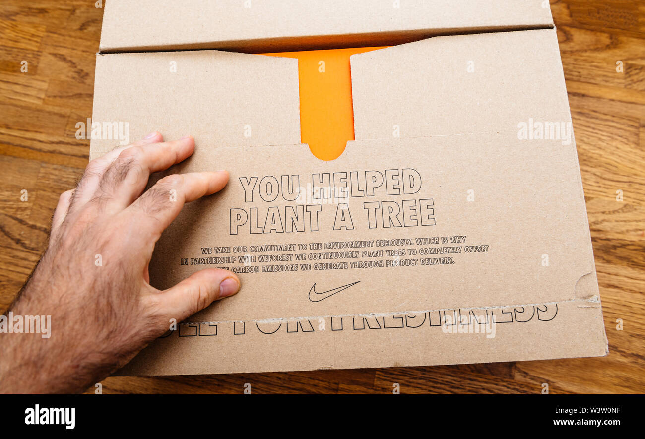 Paris France - Jul 13 2019: Above view unboxing unpacking sport running  shoes equipment manufactured byu Nike sportswear environmental message you  helped plant a tree Stock Photo - Alamy
