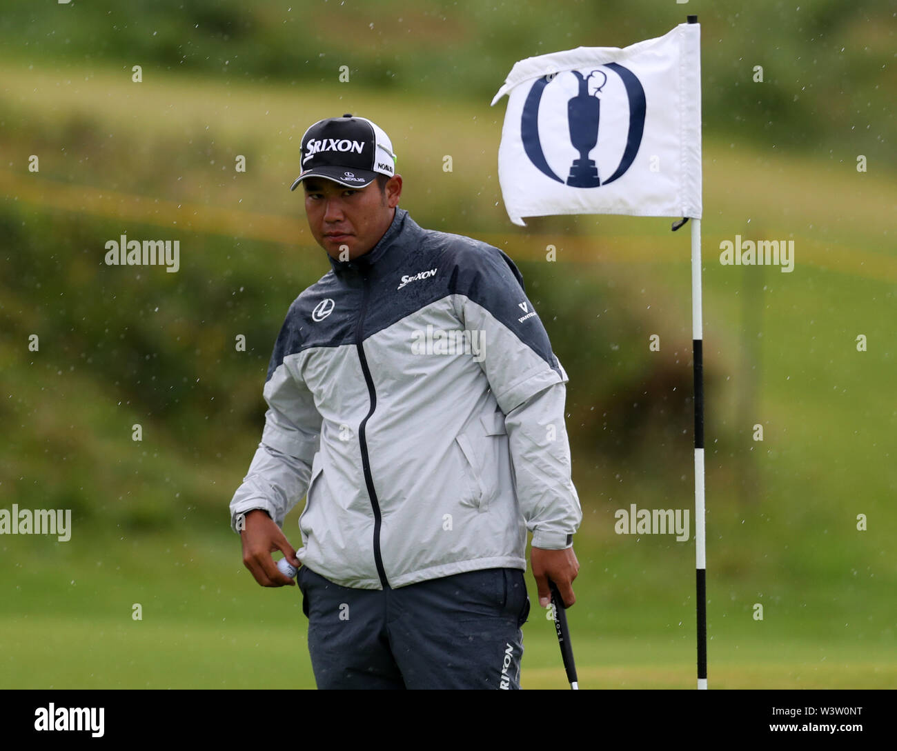 17th July, Portrush, Country Antrim, Northern Ireland; The 148th Open Golf Championship, Royal Portrush Golf Club, Practice day ; Hideki Matsuyama (JAP) watches his ball as he practices his putting on the 13th green Stock Photo