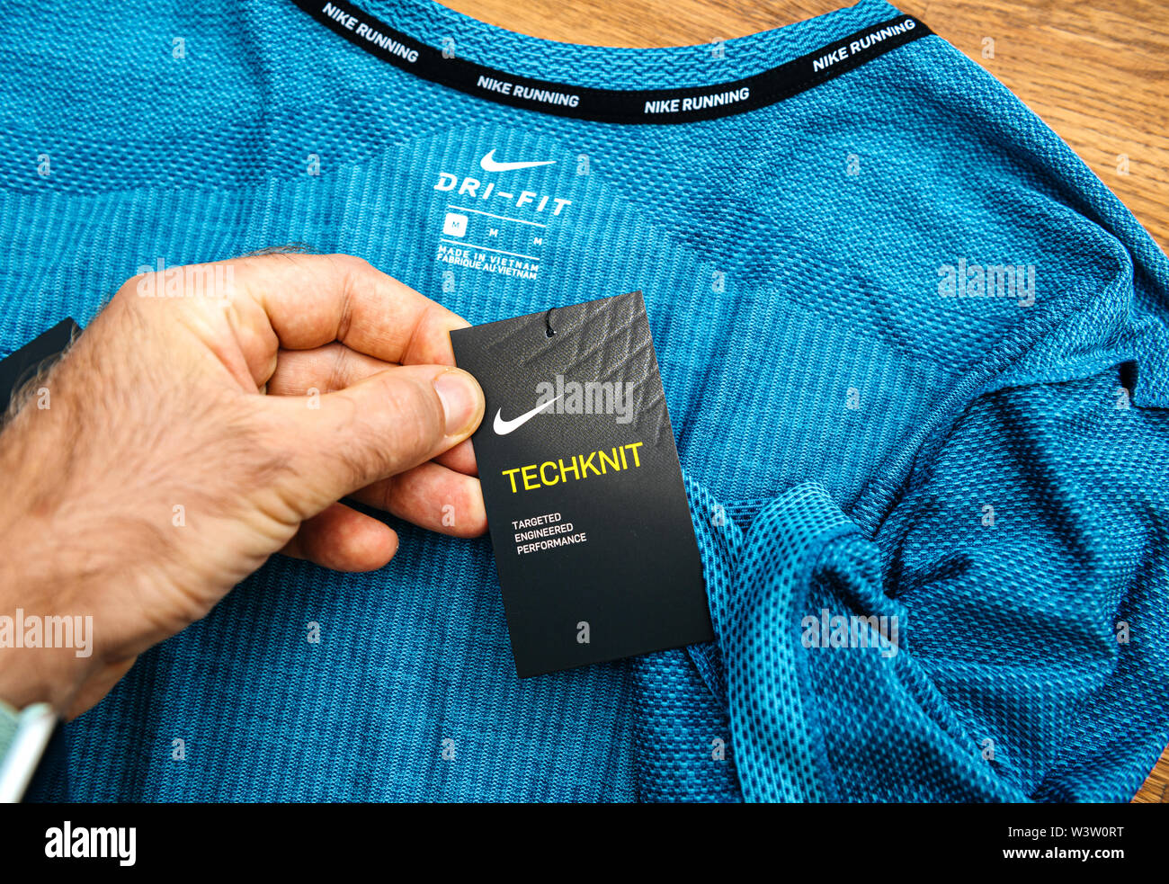 Paris, France - Jul 13, 2019: Man hand POV unboxing unpacking admiring  latest sport clothes equipment for running manufactured byu Nike sportswear  tag with Techknit specification Stock Photo - Alamy