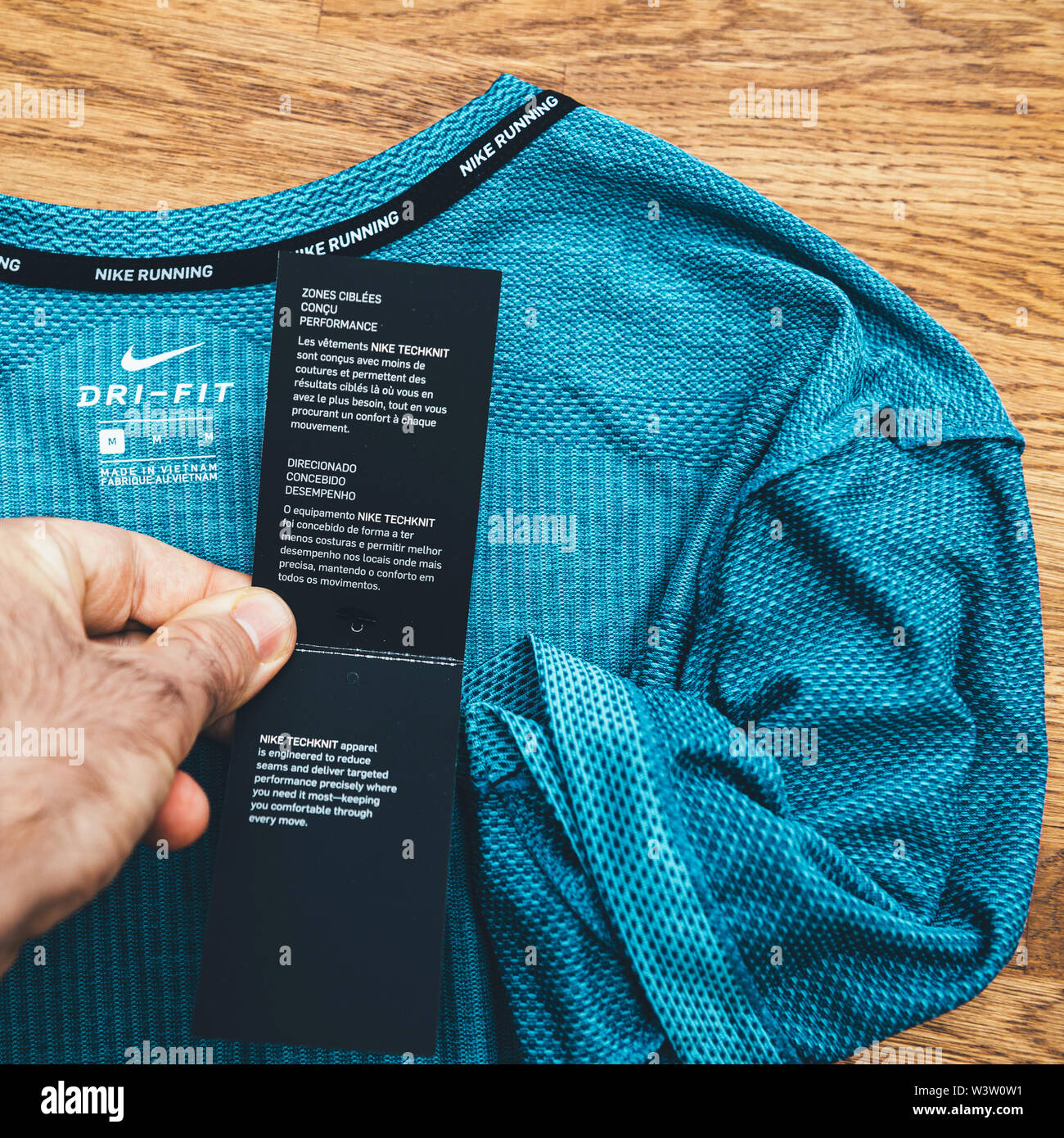 Paris, France - Jul 13, 2019: Man hand POV unboxing unpacking admiring  latest sport clothes equipment for running manufactured byu Nike sportswear  Techknit garment specification Stock Photo - Alamy