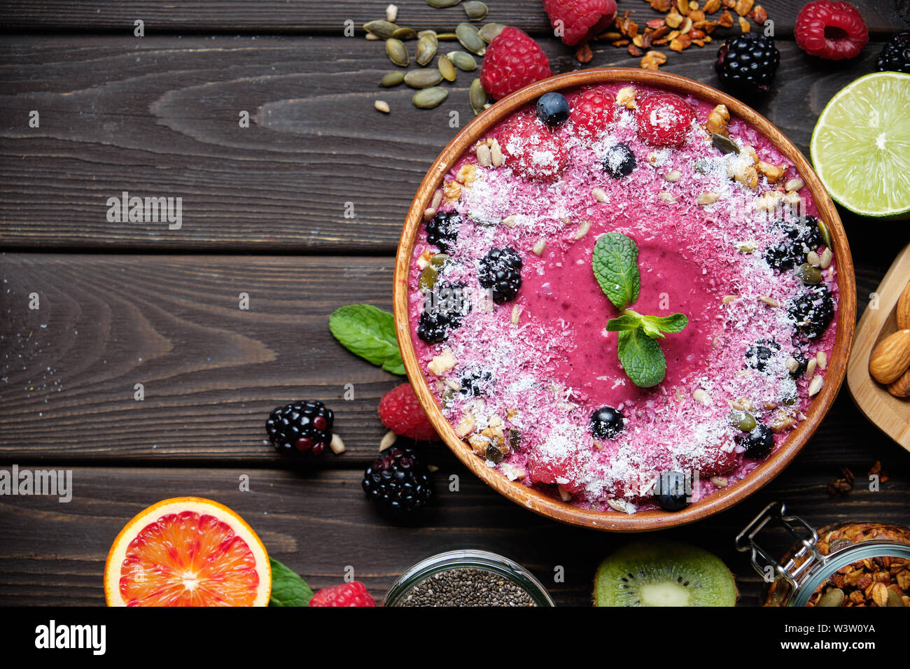 Smoothie bowls. Healthy breakfast bowl with chia seeds, muesli, berries