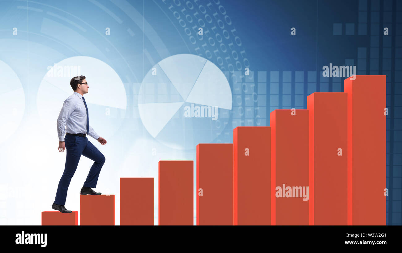 The businessman going up the bar chart in growth concept Stock Photo
