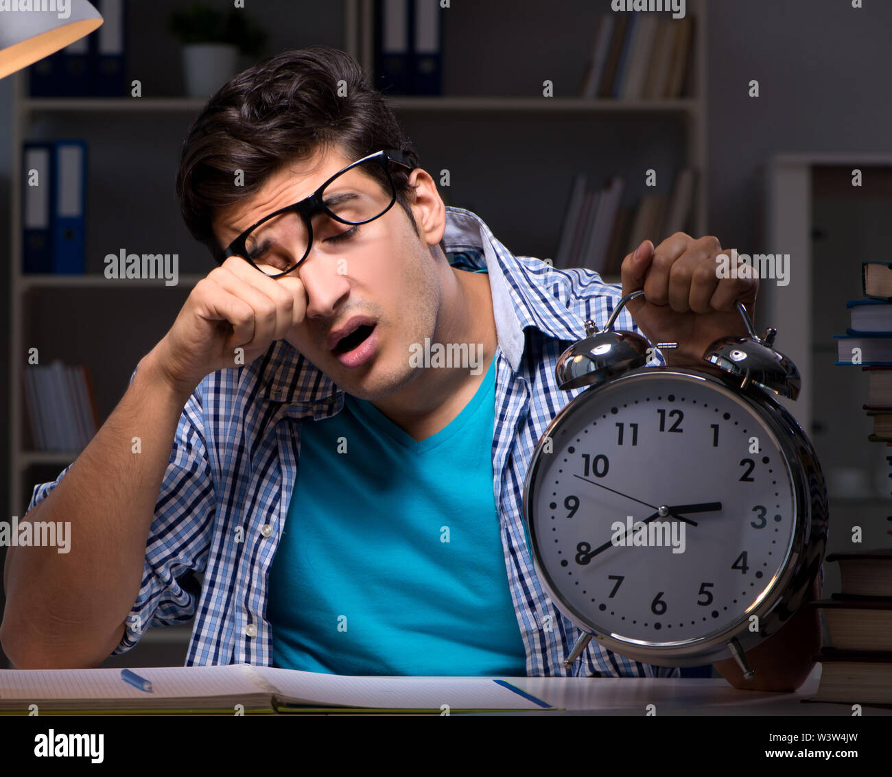 The student preparing for exams late night at home Stock Photo - Alamy