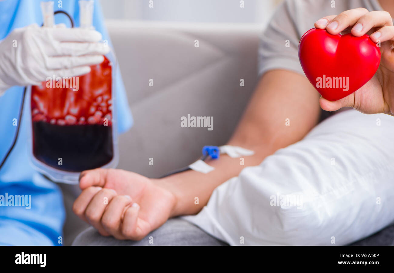 The patient getting blood transfusion in hospital clinic Stock Photo