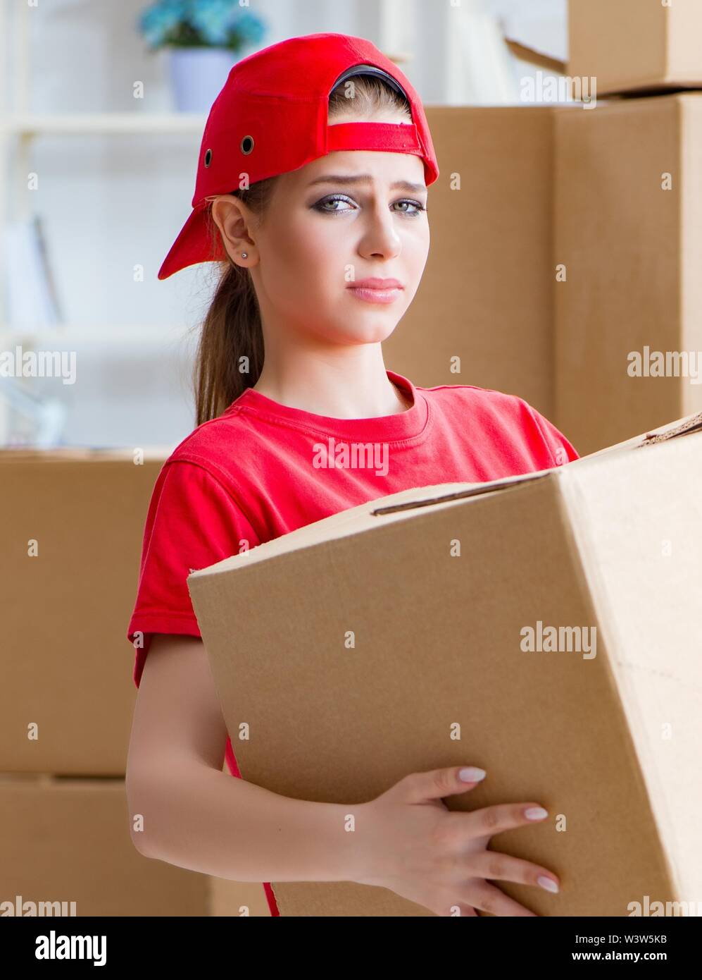 The young woman delivering boxes of personal effects Stock Photo Alamy