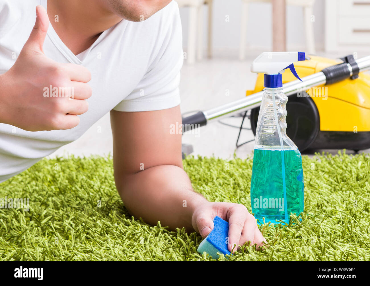 The young husband man cleaning floor at home Stock Photo Alamy