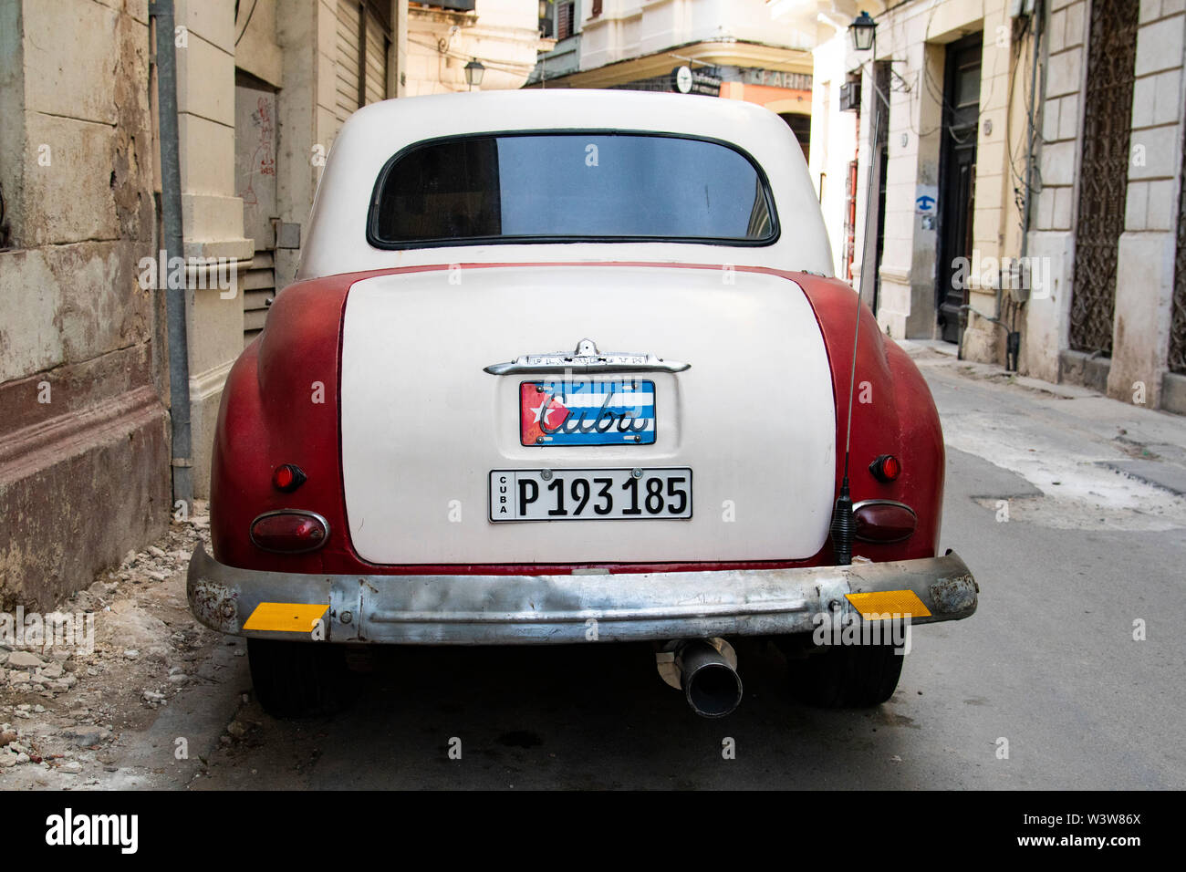 A vintage Plymouth sits parked on the street in Havana, Cuba Stock Photo