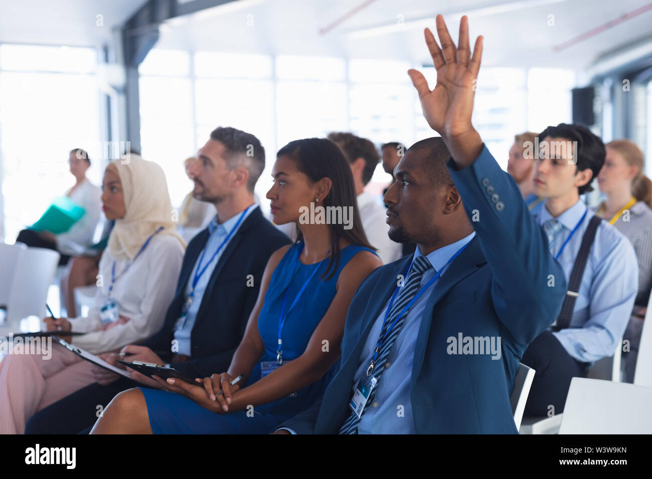 Business person raising hand hi-res stock photography and images - Alamy