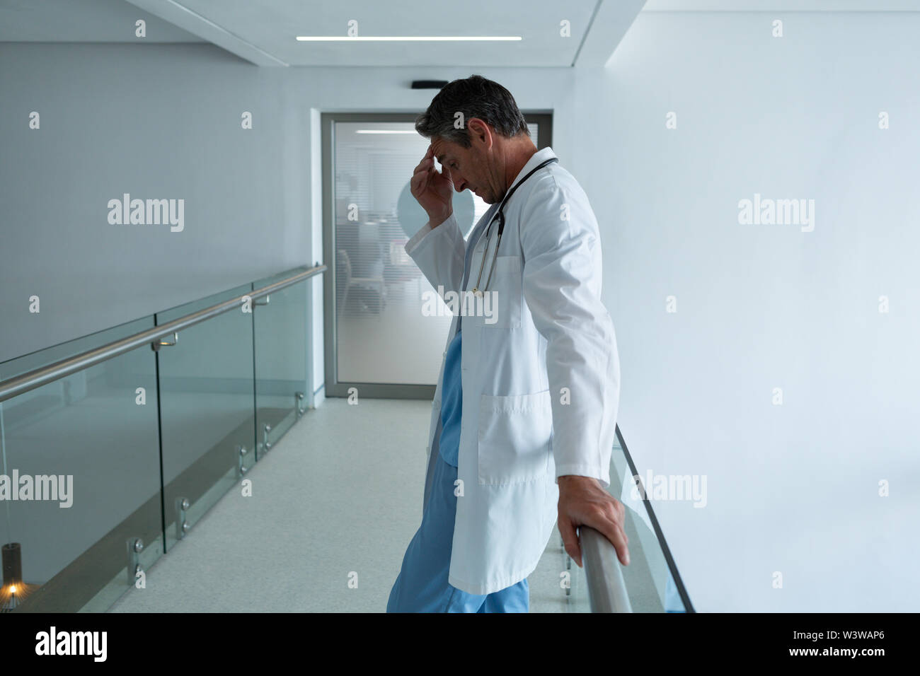 Male surgeon standing in the corridor in hospital Stock Photo - Alamy